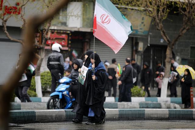 (260313) -- TEHRAN, March 13, 2026 (Xinhua) -- People attend a mass rally to mark International Quds Day in Tehran, capital of Iran, March 13, 2026. People across Iran on Friday took to the streets to mark International Quds Day, an annual event expressing support for Palestinians and condemnation of Israeli actions.
   In the capital, people marched from 10 different locations towards the iconic Enghelab Square in central Tehran, while waving Iran's flags and holding pictures of Iran's late Supreme Leader Ali Khamenei and his successor, Mojtaba Khamenei. (Xinhua)