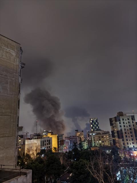 (260313) -- TEHRAN, March 13, 2026 (Xinhua) -- Smokes are seen after airstrikes in Tehran, capital of Iran, March 13, 2026. Several explosions were heard on Friday night in different areas of the Iranian capital Tehran, including the city's western and eastern parts. (Xinhua)