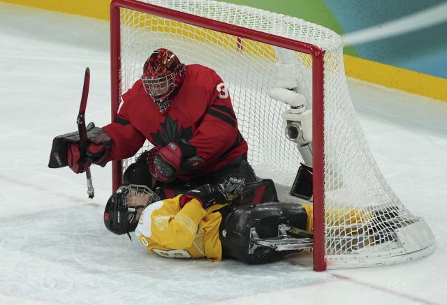(260314) -- MILAN, March 14, 2026 (Xinhua) -- Tian Jintao (below) of China competes during the Para Ice Hockey semifinal match between the Canada and China at the Milan-Cortina 2026 Paralympic Winter Games in Milan , Italy, March 13, 2025. (Xinhua/Hou Jun)