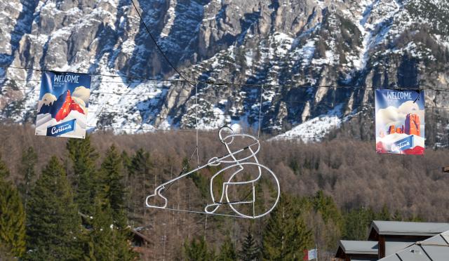 (260314) -- CORTINA D'AMPEZZO, March 14, 2026 (Xinhua) -- Photo taken on March 4, 2026 shows decorations of Milan-Cortina 2026 Paralympic Winter Games in Cortina d'Ampezzo, Italy. Cortina d'Ampezzo, nestled in the Dolomites, a UNESCO World Heritage Site, is a winter sports destination that has hosted the Winter Olympics twice. The 1956 Winter Olympic Games left enduring venues such as the Cortina Curling Stadium, which hosted the curling events at the 2026 Winter Olympic Games and is hosting the wheelchair curling at the Paralympic Winter Games.  
Cortina's winter sports heritage dates back to 1897, with legendary slopes including the Olympia delle Tofane.
As the 2026 Paralympic Winter Games conclude on March 15, Cortina will host the closing ceremony. The flame's extinguishment here will symbolize unity, bridging 70 years of Olympic legacy. (Xinhua/Wang Kaiyan)