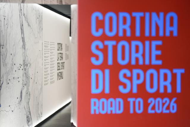 (260314) -- CORTINA D'AMPEZZO, March 14, 2026 (Xinhua) -- This photo taken on March 4, 2026 shows the entrance to the Cortina Story of Sport Exhibition in Cortina D'Ampezzo, Italy. Cortina d'Ampezzo, nestled in the Dolomites, a UNESCO World Heritage Site, is a winter sports destination that has hosted the Winter Olympics twice. The 1956 Winter Olympic Games left enduring venues such as the Cortina Curling Stadium, which hosted the curling events at the 2026 Winter Olympic Games and is hosting the wheelchair curling at the Paralympic Winter Games.  
Cortina's winter sports heritage dates back to 1897, with legendary slopes including the Olympia delle Tofane.
As the 2026 Paralympic Winter Games conclude on March 15, Cortina will host the closing ceremony. The flame's extinguishment here will symbolize unity, bridging 70 years of Olympic legacy. (Xinhua/Lian Zhen)