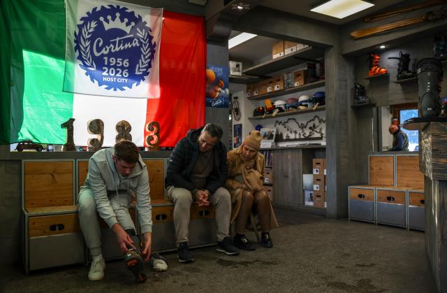 (260314) -- CORTINA D'AMPEZZO, March 14, 2026 (Xinhua) -- Ski enthusiasts try on ski boots at a ski rental shop in Cortina d'Ampezzo, Italy, on March 5, 2026. Cortina d'Ampezzo, nestled in the Dolomites, a UNESCO World Heritage Site, is a winter sports destination that has hosted the Winter Olympics twice. The 1956 Winter Olympic Games left enduring venues such as the Cortina Curling Stadium, which hosted the curling events at the 2026 Winter Olympic Games and is hosting the wheelchair curling at the Paralympic Winter Games.  
Cortina's winter sports heritage dates back to 1897, with legendary slopes including the Olympia delle Tofane.
As the 2026 Paralympic Winter Games conclude on March 15, Cortina will host the closing ceremony. The flame's extinguishment here will symbolize unity, bridging 70 years of Olympic legacy. (Xinhua/Wang Kaiyan)