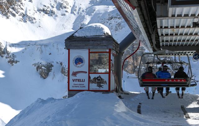 (260314) -- CORTINA D'AMPEZZO, March 14, 2026 (Xinhua) -- Skiers take a cablecar at the ski resort Faloria, which hosted the giant slalom competition in the 1956 Winter Olympic Games, in Cortina d'Ampezzo, Italy, on March 5, 2026. Cortina d'Ampezzo, nestled in the Dolomites, a UNESCO World Heritage Site, is a winter sports destination that has hosted the Winter Olympics twice. The 1956 Winter Olympic Games left enduring venues such as the Cortina Curling Stadium, which hosted the curling events at the 2026 Winter Olympic Games and is hosting the wheelchair curling at the Paralympic Winter Games.  
Cortina's winter sports heritage dates back to 1897, with legendary slopes including the Olympia delle Tofane.
As the 2026 Paralympic Winter Games conclude on March 15, Cortina will host the closing ceremony. The flame's extinguishment here will symbolize unity, bridging 70 years of Olympic legacy. (Xinhua/Wang Kaiyan)