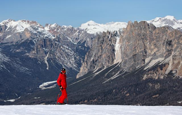 (260314) -- CORTINA D'AMPEZZO, March 14, 2026 (Xinhua) -- A skier is seen at the ski resort Faloria, which hosted the giant slalom competition at the 1956 Winter Olympic Games, in Cortina d'Ampezzo, Italy, on March 5, 2026. Cortina d'Ampezzo, nestled in the Dolomites, a UNESCO World Heritage Site, is a winter sports destination that has hosted the Winter Olympics twice. The 1956 Winter Olympic Games left enduring venues such as the Cortina Curling Stadium, which hosted the curling events at the 2026 Winter Olympic Games and is hosting the wheelchair curling at the Paralympic Winter Games.  
Cortina's winter sports heritage dates back to 1897, with legendary slopes including the Olympia delle Tofane.
As the 2026 Paralympic Winter Games conclude on March 15, Cortina will host the closing ceremony. The flame's extinguishment here will symbolize unity, bridging 70 years of Olympic legacy. (Xinhua/Wang Kaiyan)