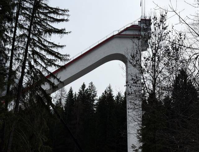 (260314) -- CORTINA D'AMPEZZO, March 14, 2026 (Xinhua) -- This photo taken with a smart phone on March 12, 2026 shows a view of Olympic Ski Jumping Hill, which was used for the ski jumping competition at 1956 Winter Olympic Games, in Cortina D'ampezzo, Italy. Cortina d'Ampezzo, nestled in the Dolomites, a UNESCO World Heritage Site, is a winter sports destination that has hosted the Winter Olympics twice. The 1956 Winter Olympic Games left enduring venues such as the Cortina Curling Stadium, which hosted the curling events at the 2026 Winter Olympic Games and is hosting the wheelchair curling at the Paralympic Winter Games.  
Cortina's winter sports heritage dates back to 1897, with legendary slopes including the Olympia delle Tofane.
As the 2026 Paralympic Winter Games conclude on March 15, Cortina will host the closing ceremony. The flame's extinguishment here will symbolize unity, bridging 70 years of Olympic legacy. (Xinhua/Cai Yang)