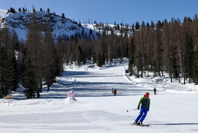 (260314) -- CORTINA D'AMPEZZO, March 14, 2026 (Xinhua) -- Skiers ski at the ski resort Faloria, which hosted the giant slalom competition at the 1956 Winter Olympic Games, in Cortina d'Ampezzo, Italy, on March 5, 2026. Cortina d'Ampezzo, nestled in the Dolomites, a UNESCO World Heritage Site, is a winter sports destination that has hosted the Winter Olympics twice. The 1956 Winter Olympic Games left enduring venues such as the Cortina Curling Stadium, which hosted the curling events at the 2026 Winter Olympic Games and is hosting the wheelchair curling at the Paralympic Winter Games.  
Cortina's winter sports heritage dates back to 1897, with legendary slopes including the Olympia delle Tofane.
As the 2026 Paralympic Winter Games conclude on March 15, Cortina will host the closing ceremony. The flame's extinguishment here will symbolize unity, bridging 70 years of Olympic legacy. (Xinhua/Wang Kaiyan)