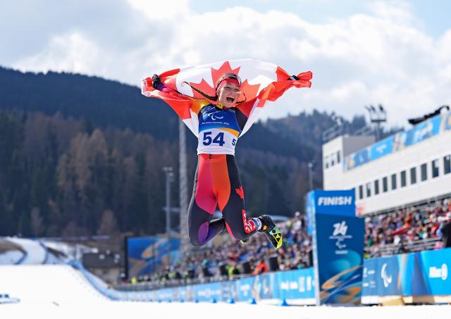 (260314) -- TESERO, March 14, 2026 (Xinhua) -- Natalie Wilkie of Canada celebrates after the para biathlon women's sprint pursuit standing at the Milan-Cortina 2026 Paralympic Winter Games in Tesero, Italy, March 13, 2026. (Xinhua/Hou Zhaokang)