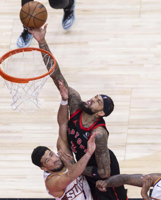 (260314) -- TORONTO, March 14, 2026 (Xinhua) -- Brandon Ingram (R) of Toronto Raptors goes up for a layup during the 2025-2026 NBA regular season game between Toronto Raptors and Phoenix Suns in Toronto, Canada, on March 13, 2026. (Photo by Zou Zheng/Xinhua)