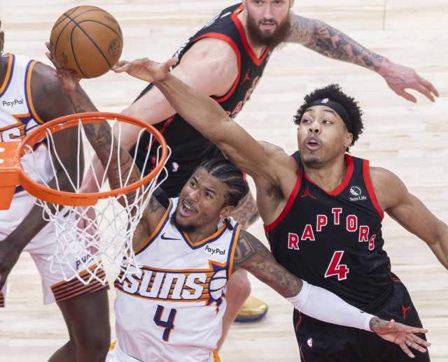 (260314) -- TORONTO, March 14, 2026 (Xinhua) -- Jalen Green (front L) of Phoenix Suns goes up for a layup during the 2025-2026 NBA regular season game between Toronto Raptors and Phoenix Suns in Toronto, Canada, on March 13, 2026. (Photo by Zou Zheng/Xinhua)