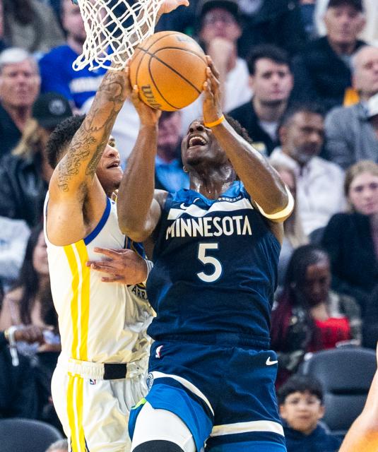 (260314) -- SAN FRANCISCO, March 14, 2026 (Xinhua) -- Minnesota Timberwolves' Anthony Edwards (R) goes to basket during the 2025-2026 NBA regular season basketball game between Minnesota Timberwolves and Golden State Warriors in San Francisco, the United States, March 13, 2026. (Photo by Dong Xudong/Xinhua)