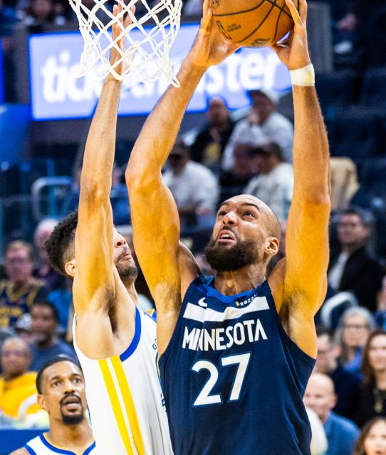 (260314) -- SAN FRANCISCO, March 14, 2026 (Xinhua) -- Minnesota Timberwolves' Rudy Gobert (R) goes to basket during the 2025-2026 NBA regular season basketball game between Minnesota Timberwolves and Golden State Warriors in San Francisco, the United States, March 13, 2026. (Photo by Dong Xudong/Xinhua)