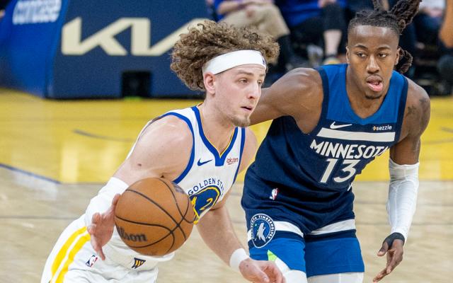 (260314) -- SAN FRANCISCO, March 14, 2026 (Xinhua) -- Golden State Warriors' Brandin Podziemski (L) dribbles the ball during the 2025-2026 NBA regular season basketball game between Minnesota Timberwolves and Golden State Warriors in San Francisco, the United States, March 13, 2026. (Photo by Dong Xudong/Xinhua)