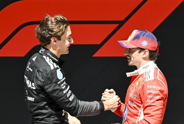 (260314) -- SHANGHAI, March 14, 2026 (Xinhua) -- First-placed Mercedes' George Russell (L) of Britain shakes hands with second-placed Ferrari's Charles Leclerc of Monaco after the Sprint race of Formula One Chinese Grand Prix at Shanghai International Circuit in Shanghai, China, March 14, 2026. (Xinhua/Chen Haoming)