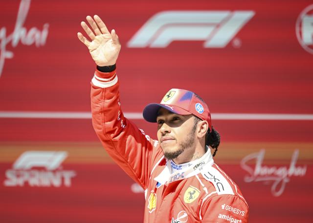 (260314) -- SHANGHAI, March 14, 2026 (Xinhua) -- Ferrari's Lewis Hamilton of Britain waves to the crowd after the Sprint race of Formula One Chinese Grand Prix at Shanghai International Circuit in Shanghai, China, March 14, 2026. (Xinhua/Chen Haoming)