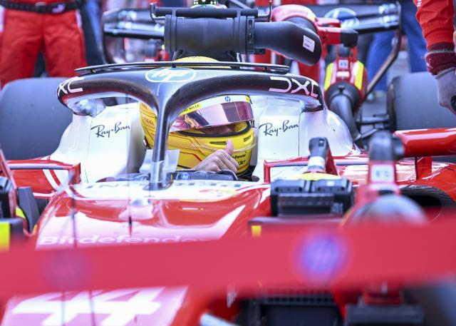 (260314) -- SHANGHAI, March 14, 2026 (Xinhua) -- Ferrari's Lewis Hamilton of Britain is seen ahead of the Sprint race of Formula One Chinese Grand Prix at Shanghai International Circuit in Shanghai, China, March 14, 2026. (Xinhua/Chen Haoming)