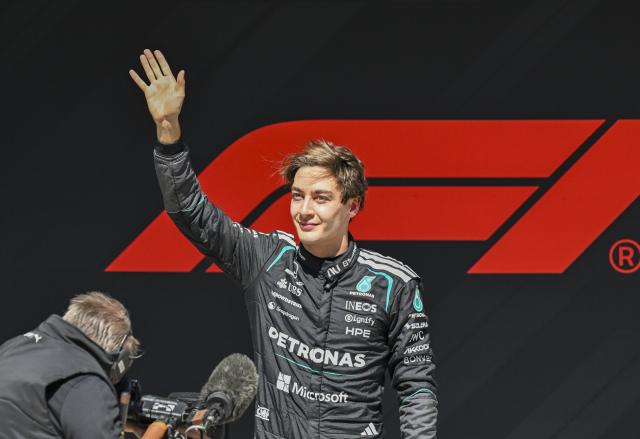 (260314) -- SHANGHAI, March 14, 2026 (Xinhua) -- First-placed Mercedes' George Russell of Britain waves to the crowd after the Sprint race of Formula One Chinese Grand Prix at Shanghai International Circuit in Shanghai, China, March 14, 2026. (Xinhua/Chen Haoming)