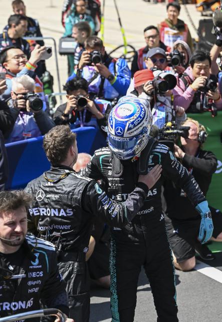 (260314) -- SHANGHAI, March 14, 2026 (Xinhua) -- Mercedes' George Russell (R,front) of Britain celebrates after winning the Sprint race of Formula One Chinese Grand Prix at Shanghai International Circuit in Shanghai, China, March 14, 2026. (Xinhua/Chen Haoming)