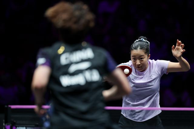(260314) -- CHONGQING, March 14, 2026 (Xinhua) -- Shin Yubin (R) of South Korea hits a return during the women's singles quarterfinal between Wang Yidi of China and Shin Yubin of South Korea at the WTT Champions Chongqing 2026 in southwest China's Chongqing, March 14, 2026. (Xinhua/Huang Wei)