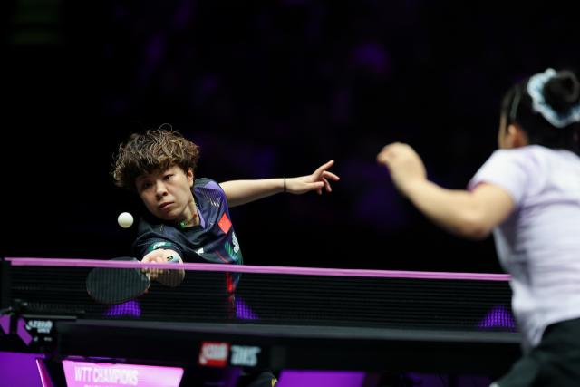 (260314) -- CHONGQING, March 14, 2026 (Xinhua) -- Wang Yidi (L) of China hits a return during the women's singles quarterfinal between Wang Yidi of China and Shin Yubin of South Korea at the WTT Champions Chongqing 2026 in southwest China's Chongqing, March 14, 2026. (Xinhua/Huang Wei)