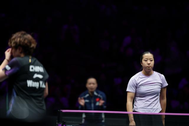 (260314) -- CHONGQING, March 14, 2026 (Xinhua) -- Shin Yubin (R) of South Korea reacts during the women's singles quarterfinal between Wang Yidi of China and Shin Yubin of South Korea at the WTT Champions Chongqing 2026 in southwest China's Chongqing, March 14, 2026. (Xinhua/Huang Wei)