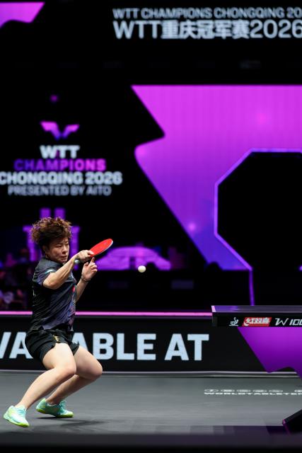 (260314) -- CHONGQING, March 14, 2026 (Xinhua) -- Wang Yidi of China hits a return during the women's singles quarterfinal between Wang Yidi of China and Shin Yubin of South Korea at the WTT Champions Chongqing 2026 in southwest China's Chongqing, March 14, 2026. (Xinhua/Huang Wei)