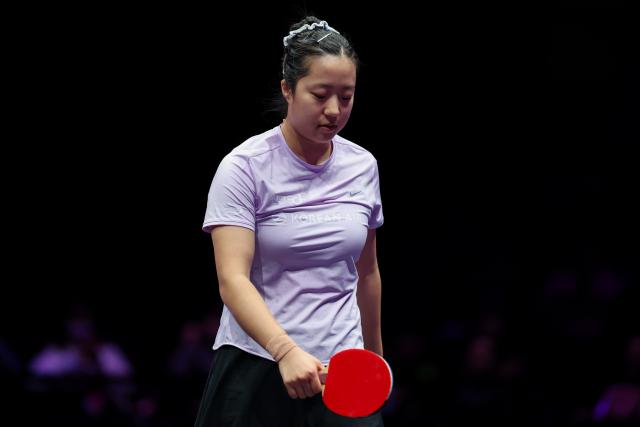(260314) -- CHONGQING, March 14, 2026 (Xinhua) -- Shin Yubin of South Korea reacts during the women's singles quarterfinal between Wang Yidi of China and Shin Yubin of South Korea at the WTT Champions Chongqing 2026 in southwest China's Chongqing, March 14, 2026. (Xinhua/Huang Wei)