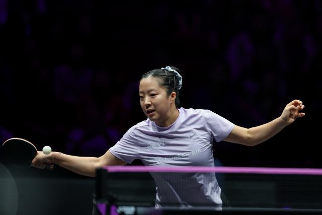(260314) -- CHONGQING, March 14, 2026 (Xinhua) -- Shin Yubin of South Korea hits a return during the women's singles quarterfinal between Wang Yidi of China and Shin Yubin of South Korea at the WTT Champions Chongqing 2026 in southwest China's Chongqing, March 14, 2026. (Xinhua/Huang Wei)