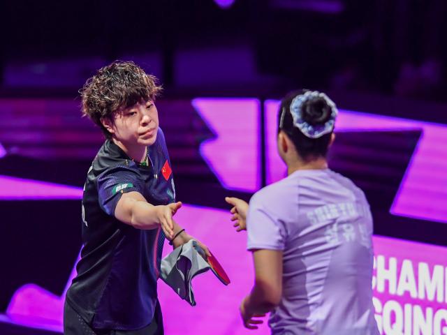 (260314) -- CHONGQING, March 14, 2026 (Xinhua) -- Wang Yidi (L) of China shakes hands with Shin Yubin of South Korea before their women's singles quarterfinal at the WTT Champions Chongqing 2026 in southwest China's Chongqing, March 14, 2026. (Xinhua/Tang Yi)