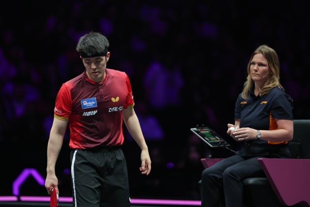 (260314) -- CHONGQING, March 14, 2026 (Xinhua) -- Qiu Dang of Germany reacts during the men's singles quarterfinal match between Wen Ruibo of China and Qiu Dang of Germany at the WTT Champions Chongqing 2026 in southwest China's Chongqing, March 14, 2026. (Xinhua/Huang Wei)