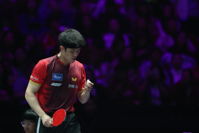 (260314) -- CHONGQING, March 14, 2026 (Xinhua) -- Qiu Dang of Germany reacts during the men's singles quarterfinal match between Wen Ruibo of China and Qiu Dang of Germany at the WTT Champions Chongqing 2026 in southwest China's Chongqing, March 14, 2026. (Xinhua/Huang Wei)