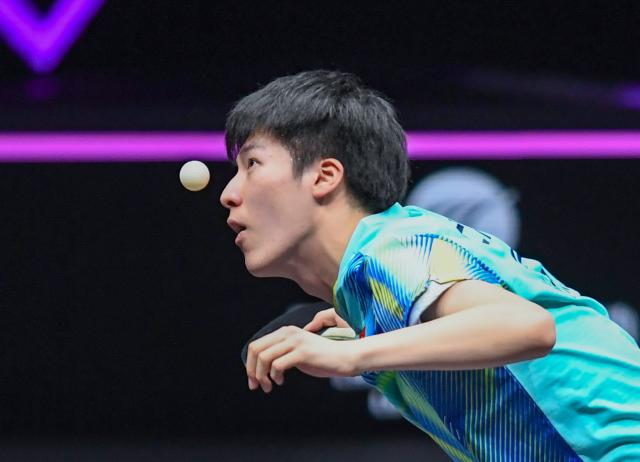 (260314) -- CHONGQING, March 14, 2026 (Xinhua) -- Wen Ruibo of China serves during the men's singles quarterfinal match between Wen Ruibo of China and Qiu Dang of Germany at the WTT Champions Chongqing 2026 in southwest China's Chongqing, March 14, 2026. (Xinhua/Tang Yi)