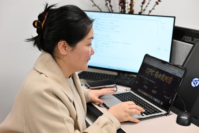 (260314) -- NANJING, March 14, 2026 (Xinhua) -- Gu Yanyan, founder of a startup company, works at a one-person-company (OPC) community in Nanjing, east China's Jiangsu Province, March 12, 2026.
  The widespread rise of AI is modifying China's labor market in ways that go far beyond job replacement or creation. It has generated new professions, lowered the threshold for starting a business, and empowered employees to upgrade their skills in a bid to stay competitive.
  The OPC model is witnessing rapid development in China, fueled by the coding capabilities of AI models and support from local governments, resulting in a greater diversity of products. This shift mirrors a broader evolution within China's professional landscape. (Xinhua/Ji Chunpeng)