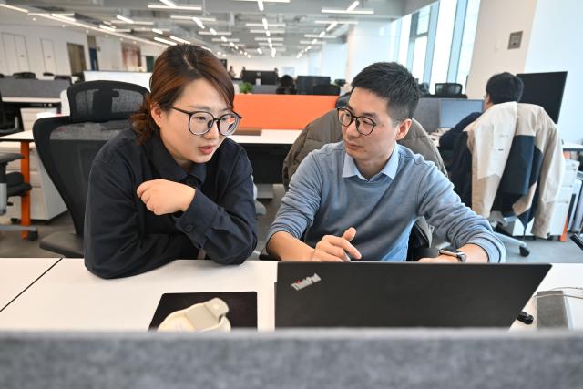 (260314) -- NANJING, March 14, 2026 (Xinhua) -- Wang Peng (R), founder of a tech startup, works at a one-person-company (OPC) community in Nanjing, east China's Jiangsu Province, March 12, 2026.
  The widespread rise of AI is modifying China's labor market in ways that go far beyond job replacement or creation. It has generated new professions, lowered the threshold for starting a business, and empowered employees to upgrade their skills in a bid to stay competitive.
  The OPC model is witnessing rapid development in China, fueled by the coding capabilities of AI models and support from local governments, resulting in a greater diversity of products. This shift mirrors a broader evolution within China's professional landscape. (Xinhua/Ji Chunpeng)