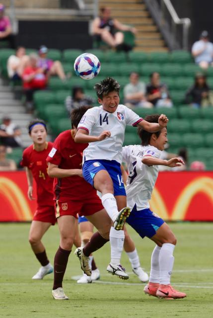 (260314) -- PERTH, March 14, 2026 (Xinhua) -- Wu Kai-ching (top) of Chinese Taipei vies for a header during the quarterfinal of Women's Asian Cup between China and Chinese Taipei at Perth Rectangular Stadium in Perth, Australia, March 14, 2026. (Photo by Zhou Dan/Xinhua)