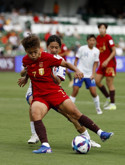 (260314) -- PERTH, March 14, 2026 (Xinhua) -- Wang Shuang (front) of China competes during the quarterfinal of Women's Asian Cup between China and Chinese Taipei at Perth Rectangular Stadium in Perth, Australia, March 14, 2026. (Xinhua/Ma Ping)