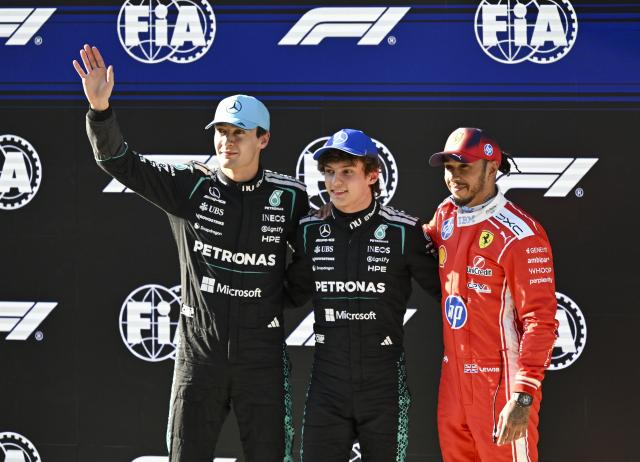 (260314) -- SHANGHAI, March 14, 2026 (Xinhua) -- Mercedes' Kimi Antonelli (C) of Italy, Mercedes' George Russell (L) of Britain and Ferrari's Lewis Hamilton of Britain wave after the Qualifying of Formula One Chinese Grand Prix at Shanghai International Circuit in Shanghai, China, March 14, 2026. (Xinhua/Chen Haoming)