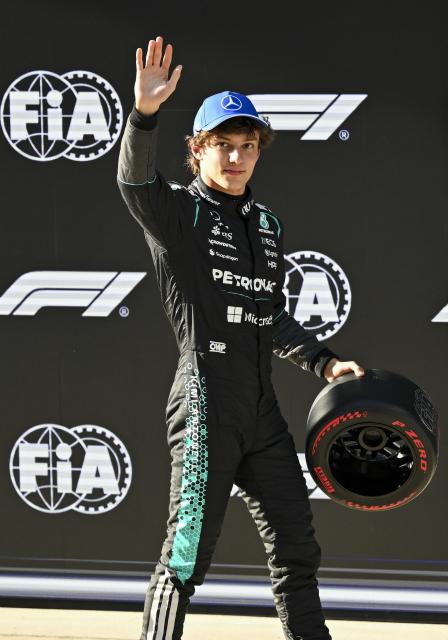 (260314) -- SHANGHAI, March 14, 2026 (Xinhua) -- Mercedes' Kimi Antonelli of Italy waves after the Qualifying of Formula One Chinese Grand Prix at Shanghai International Circuit in Shanghai, China, March 14, 2026. (Xinhua/Chen Haoming)