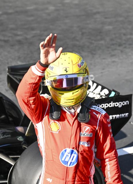 (260314) -- SHANGHAI, March 14, 2026 (Xinhua) -- Ferrari's Lewis Hamilton of Britain waves after the Qualifying of Formula One Chinese Grand Prix at Shanghai International Circuit in Shanghai, China, March 14, 2026. (Xinhua/Chen Haoming)