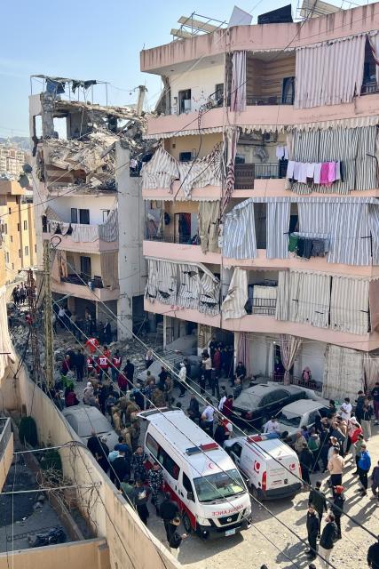 (260314) -- SIDON, March 14, 2026 (Xinhua) -- This photo taken on March 13, 2026 shows soldiers and medical personnel inspecting the site damaged by an Israeli airstrike near Sidon, Lebanon. The death toll from Israeli attacks on Lebanon since March 2 has reached 773, with 1,933 injuries, the country's Public Health Ministry said Friday. (Photo by Ali Hashisho/Xinhua)