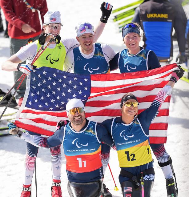 (260314) -- TESERO, March 14, 2026 (Xinhua) -- Team the United States celebrate after winning the para cross-country skiing mixed 4x2.5km relay at the Milan-Cortina 2026 Paralympic Winter Games in Tesero, Italy, March 14, 2026. (Xinhua/Hou Zhaokang)