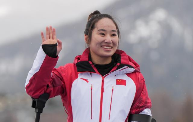 (260314) -- CORTINA D'AMPEZZO, March 14, 2026 (Xinhua) -- Gold medalist Zhang Wenjing of China reacts during the awarding ceremony for the para alpine skiing women's slalom sitting event at the Milan-Cortina 2026 Paralympic Winter Games in Cortina D'ampezzo, Italy, March 14, 2026. (Xinhua/Wang Kaiyan)