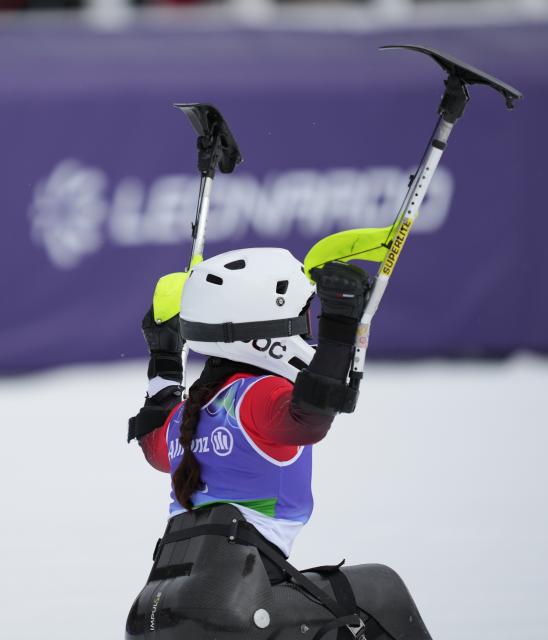 (260314) -- CORTINA D'AMPEZZO, March 14, 2026 (Xinhua) -- Zhang Wenjing of China celebrates during the para alpine skiing women's slalom sitting event at the Milan-Cortina 2026 Paralympic Winter Games in Cortina D'ampezzo, Italy, March 14, 2026. (Xinhua/Wang Kaiyan)