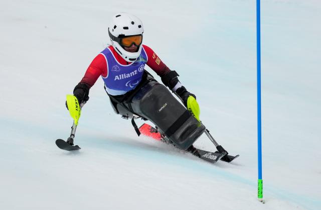 (260314) -- CORTINA D'AMPEZZO, March 14, 2026 (Xinhua) -- Zhang Wenjing of China competes during the para alpine skiing women's slalom sitting event at the Milan-Cortina 2026 Paralympic Winter Games in Cortina D'ampezzo, Italy, March 14, 2026. (Xinhua/Wang Kaiyan)