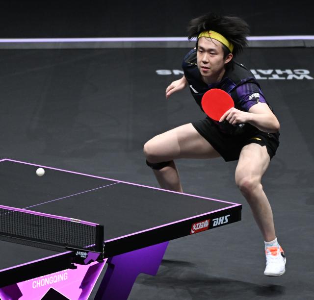 (260314) -- CHONGQING, March 14, 2026 (Xinhua) -- Wang Chuqin hits a return during the men's singles quarterfinal between Wang Chuqin of China and Matsushima Sora of Japan at the WTT Champions Chongqing 2026 in southwest China's Chongqing, March 14, 2026. (Xinhua/Chen Cheng)