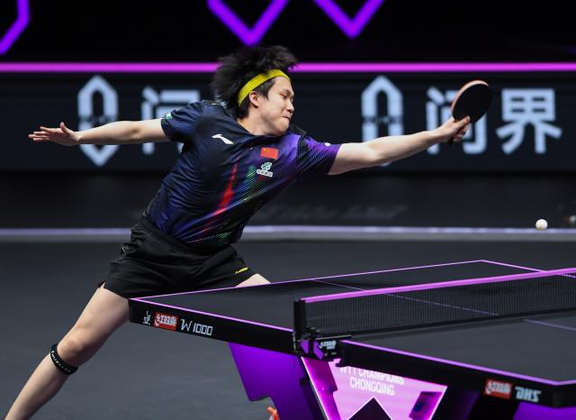 (260314) -- CHONGQING, March 14, 2026 (Xinhua) -- Wang Chuqin hits a return during the men's singles quarterfinal between Wang Chuqin of China and Matsushima Sora of Japan at the WTT Champions Chongqing 2026 in southwest China's Chongqing, March 14, 2026. (Xinhua/Tang Yi)