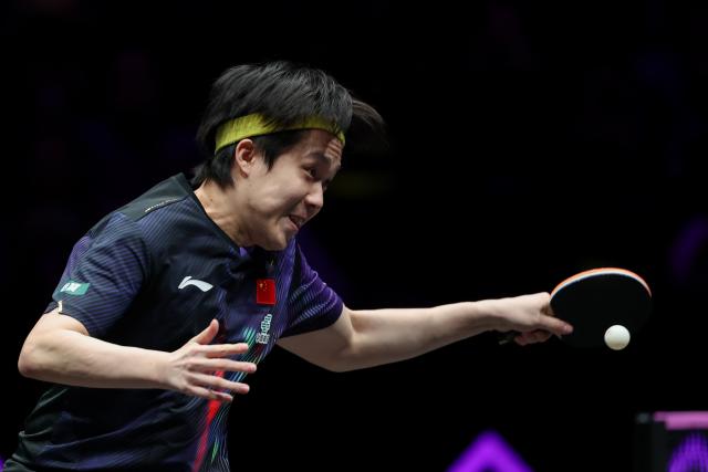 (260314) -- CHONGQING, March 14, 2026 (Xinhua) -- Wang Chuqin hits a return during the men's singles quarterfinal between Wang Chuqin of China and Matsushima Sora of Japan at the WTT Champions Chongqing 2026 in southwest China's Chongqing, March 14, 2026. (Xinhua/Huang Wei)