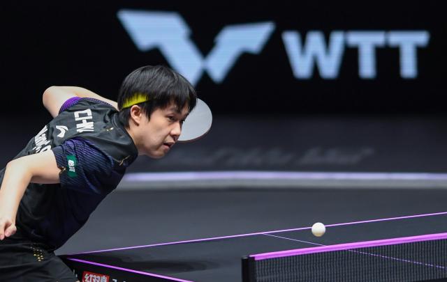 (260314) -- CHONGQING, March 14, 2026 (Xinhua) -- Wang Chuqin serves during the men's singles quarterfinal between Wang Chuqin of China and Matsushima Sora of Japan at the WTT Champions Chongqing 2026 in southwest China's Chongqing, March 14, 2026. (Xinhua/Tang Yi)
