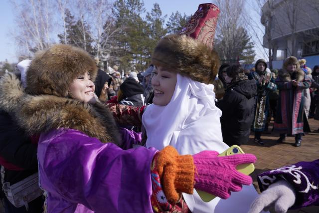 (260314) -- ASTANA, March 14, 2026 (Xinhua) -- People embrace each other during a Nauryz festival celebration in Astana, Kazakhstan, March 14, 2026. Regarded as the beginning of a New Year and one of the most important festivals in Central Asian countries, Nauryz (also known as Nowruz) marks the first day of spring. (Photo by Kalizhan Ospanov/Xinhua)