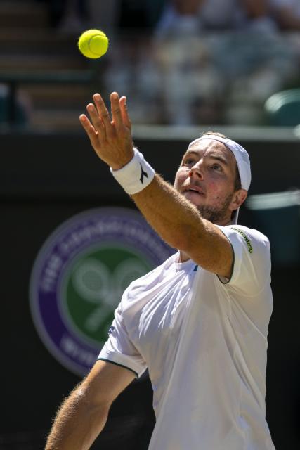 (260708) -- LONDON, July 8, 2026 (Xinhua) -- Jan-Lennard Struff serves during the men's singles quarterfinal between Jannik Sinner of Italy and Jan-Lennard Struff of Germany at the Wimbledon Tennis Championships in London, Britain, on July 7, 2026. (Photo by Stephen Chung/Xinhua)