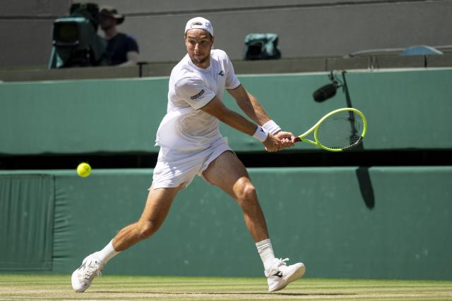 (260708) -- LONDON, July 8, 2026 (Xinhua) -- Jan-Lennard Struff hits a return during the men's singles quarterfinal between Jannik Sinner of Italy and Jan-Lennard Struff of Germany at the Wimbledon Tennis Championships in London, Britain, on July 7, 2026. (Photo by Stephen Chung/Xinhua)